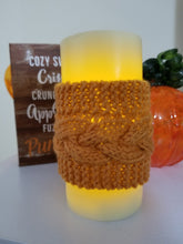 Load image into Gallery viewer, These decorative cozies are to be used with flameless candles only and are made to fit a 3 inch round candle. With the same candle, change the cozy for various holidays & seasons or match your room decor!  Two individual sizes and many different colors available - Large is approximately 5 inches tall, small is approximately 3 inches tall  Use the code "Candle Cozy Set" at checkout to receive $1 off the purchase of two or more items.