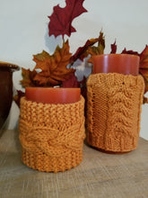 Load image into Gallery viewer, These decorative cozies are to be used with flameless candles only and are made to fit a 3 inch round candle. With the same candle, change the cozy for various holidays & seasons or match your room decor!  Two individual sizes and many different colors available - Large is approximately 5 inches tall, small is approximately 3 inches tall  Use the code "Candle Cozy Set" at checkout to receive $1 off the purchase of two or more items.