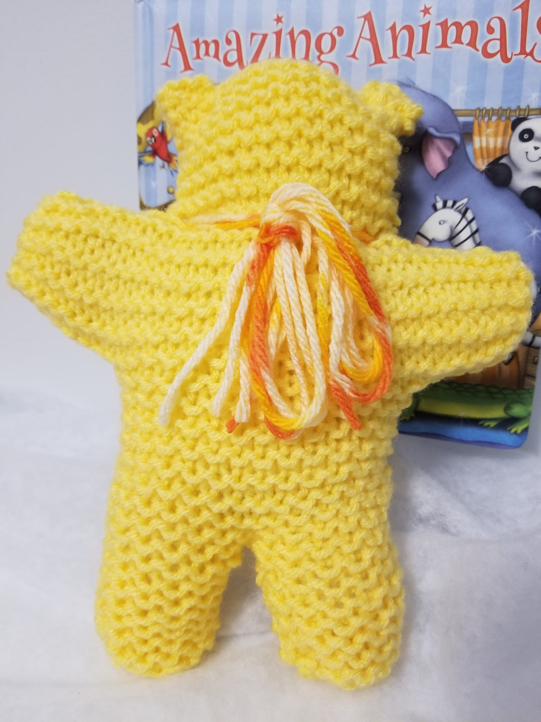 Cozy Teddy is approximately 8 inches high and 6 inches across arms. A simple little teddy for decoration or play. Many colors available.